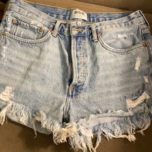 AGOLDE "Parker" distressed cut-off denim shorts.